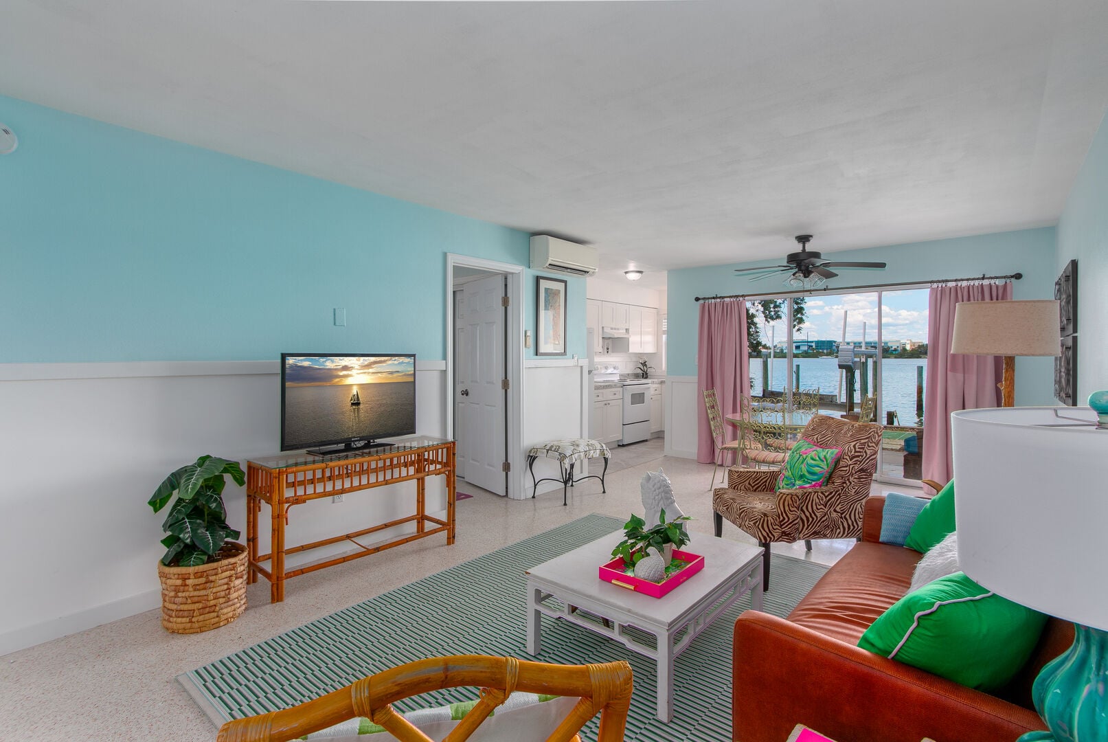 Bay Watch 3: Cozy waterfront living area with a comfortable couch and Smart TV—perfect for relaxing after a beach day.