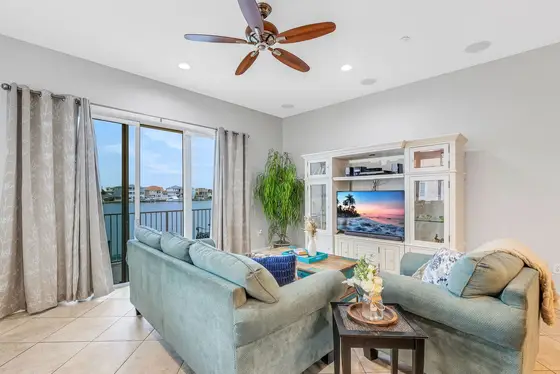 Boasting 2,400 sq. ft. of interior elegance and a spectacular private rooftop terrace, this end-unit offers panoramic views of the Intercoastal Waterway and frequent dolphin sightings.