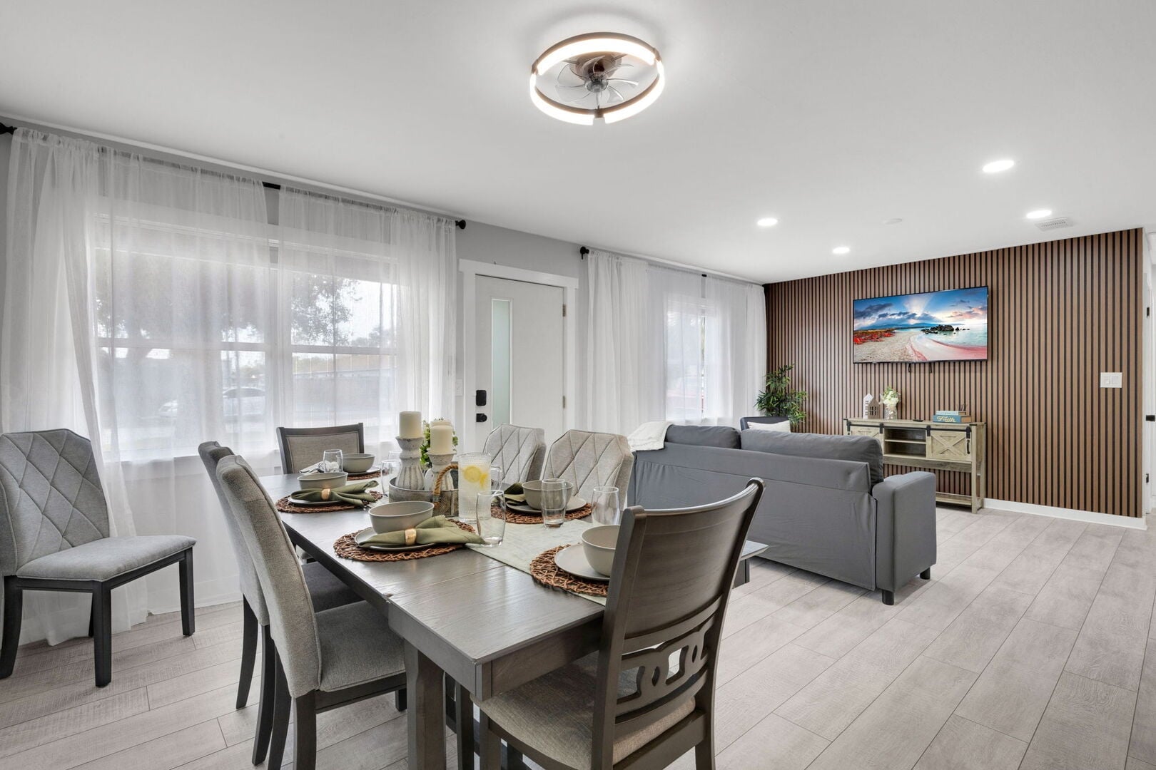 Flamingo Pool House: Bright and inviting living area with comfortable seating and an open layout perfect for relaxing after a beach day.