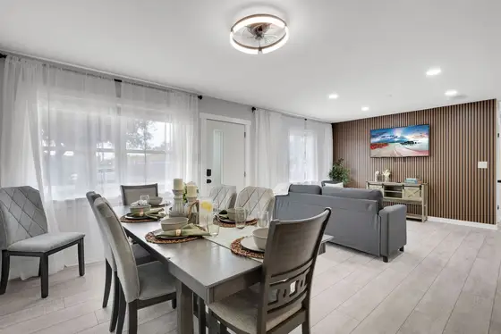 Bright and inviting living area with comfortable seating and an open layout perfect for relaxing after a beach day.