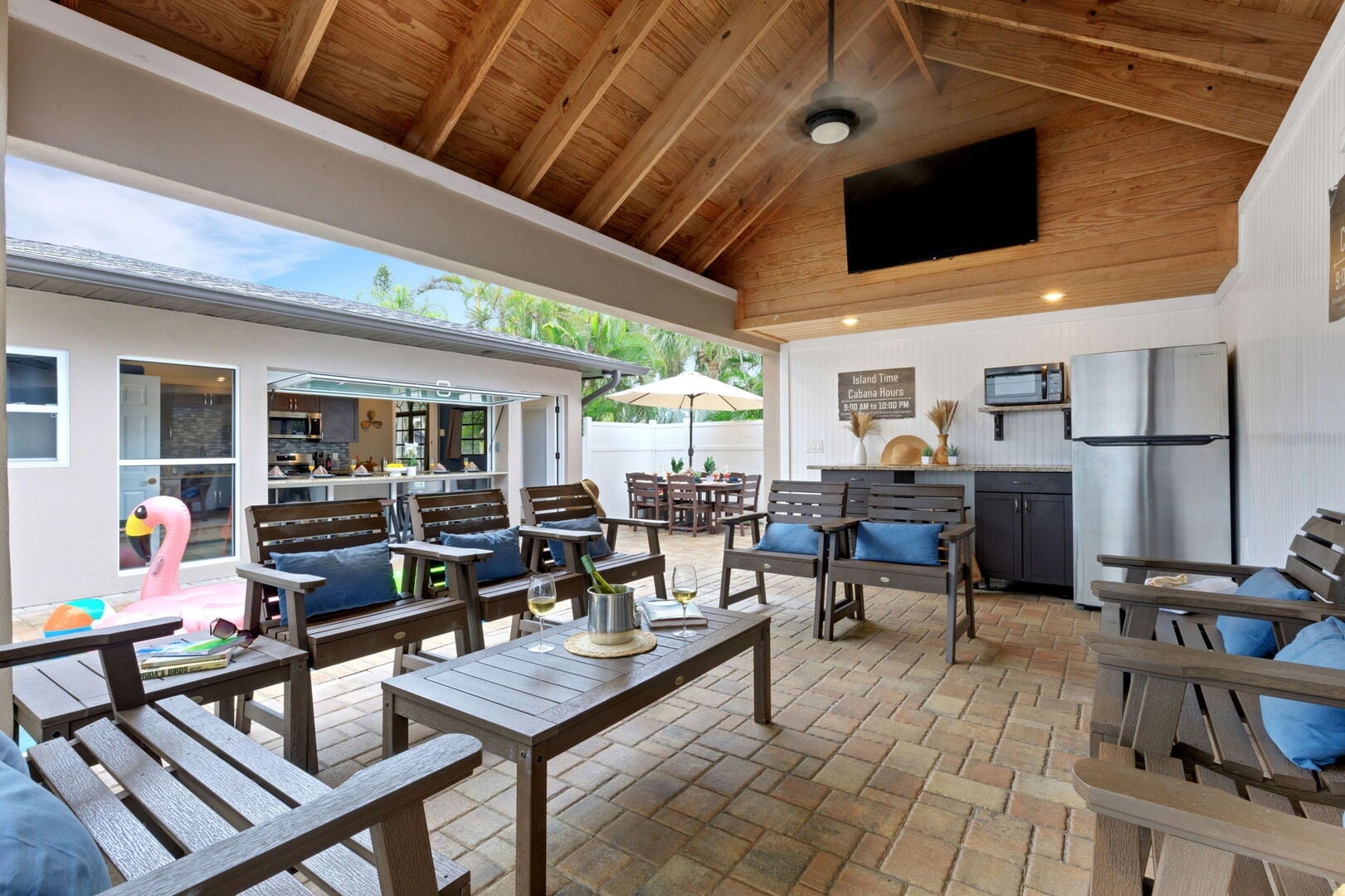 Island Time: Resort-Style Pool Area – Private heated pool (fee applies) with a covered cabana and outdoor TV.