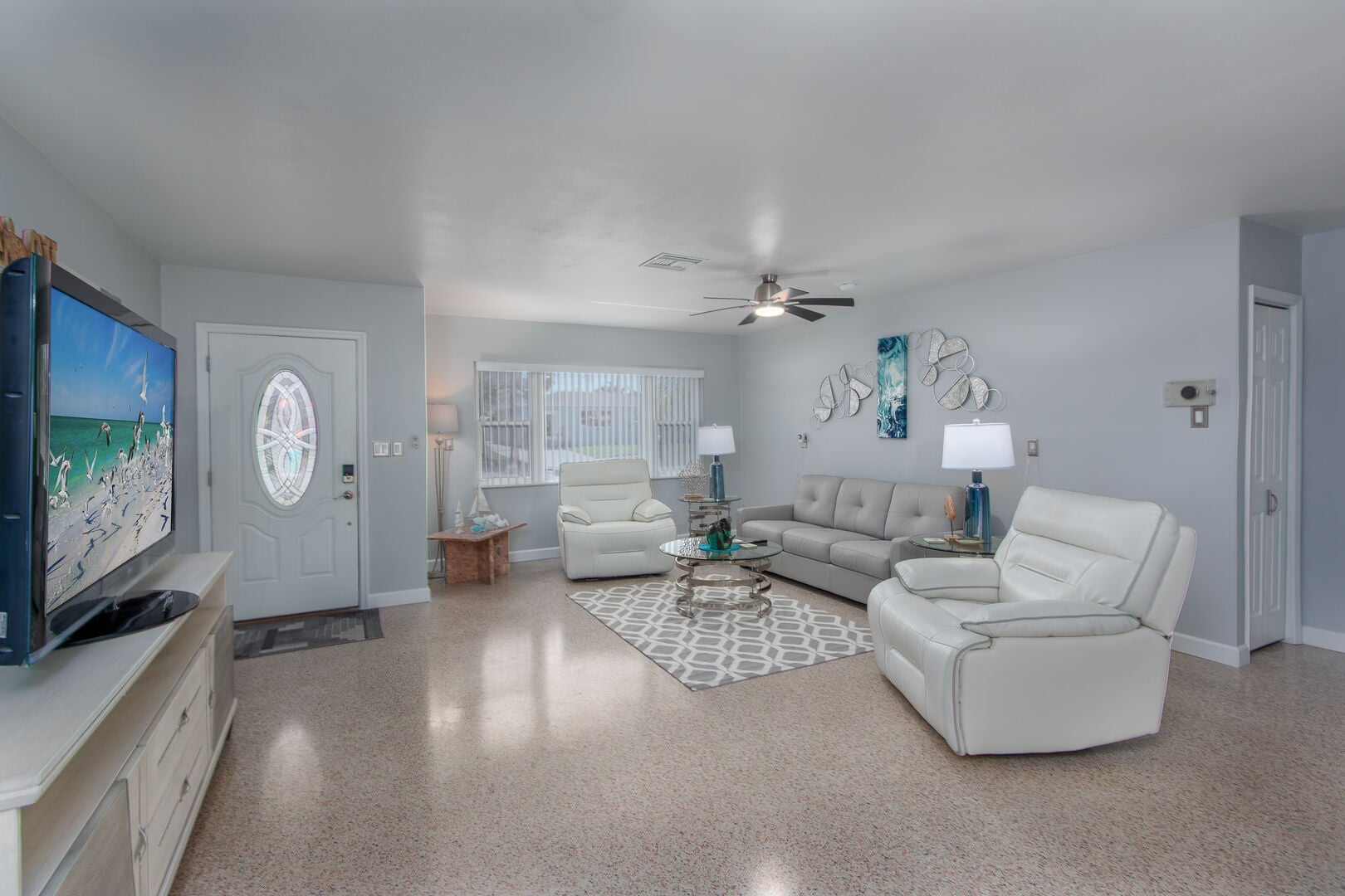 Paradise Corner: The welcoming living room offers a queen sleeper sofa, creating extra space for guests to relax, gather, or settle in for a comfortable night's sleep.