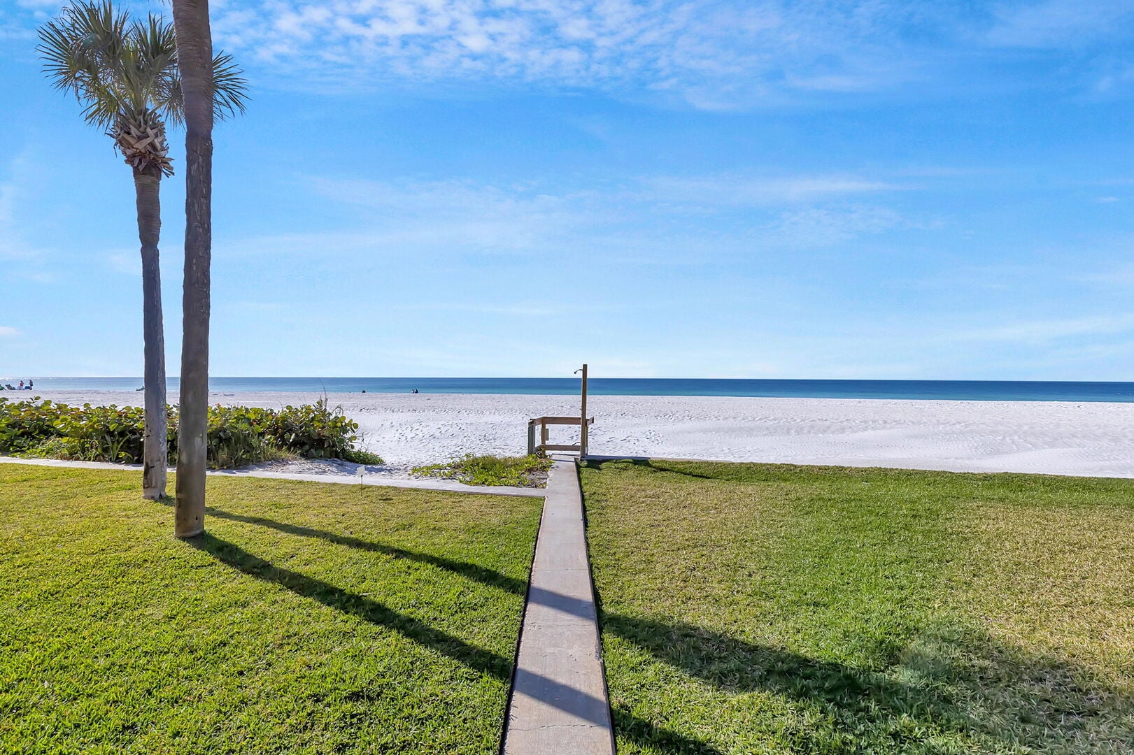 Sandy Beach Villa: Imagine waking up, grabbing your coffee, and strolling 45 steps to the beach for morning waves.