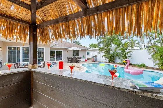 Outdoor Tiki Bar – A fun, tropical spot by the pool to serve drinks and hang out.