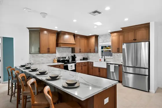 The fully renovated kitchen offers ample space for preparing meals for large groups.