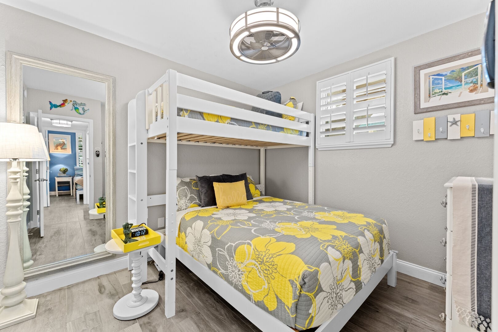 A fun and functional bunk room with a queen bed below and twin loft above, ideal for families or groups traveling together.
