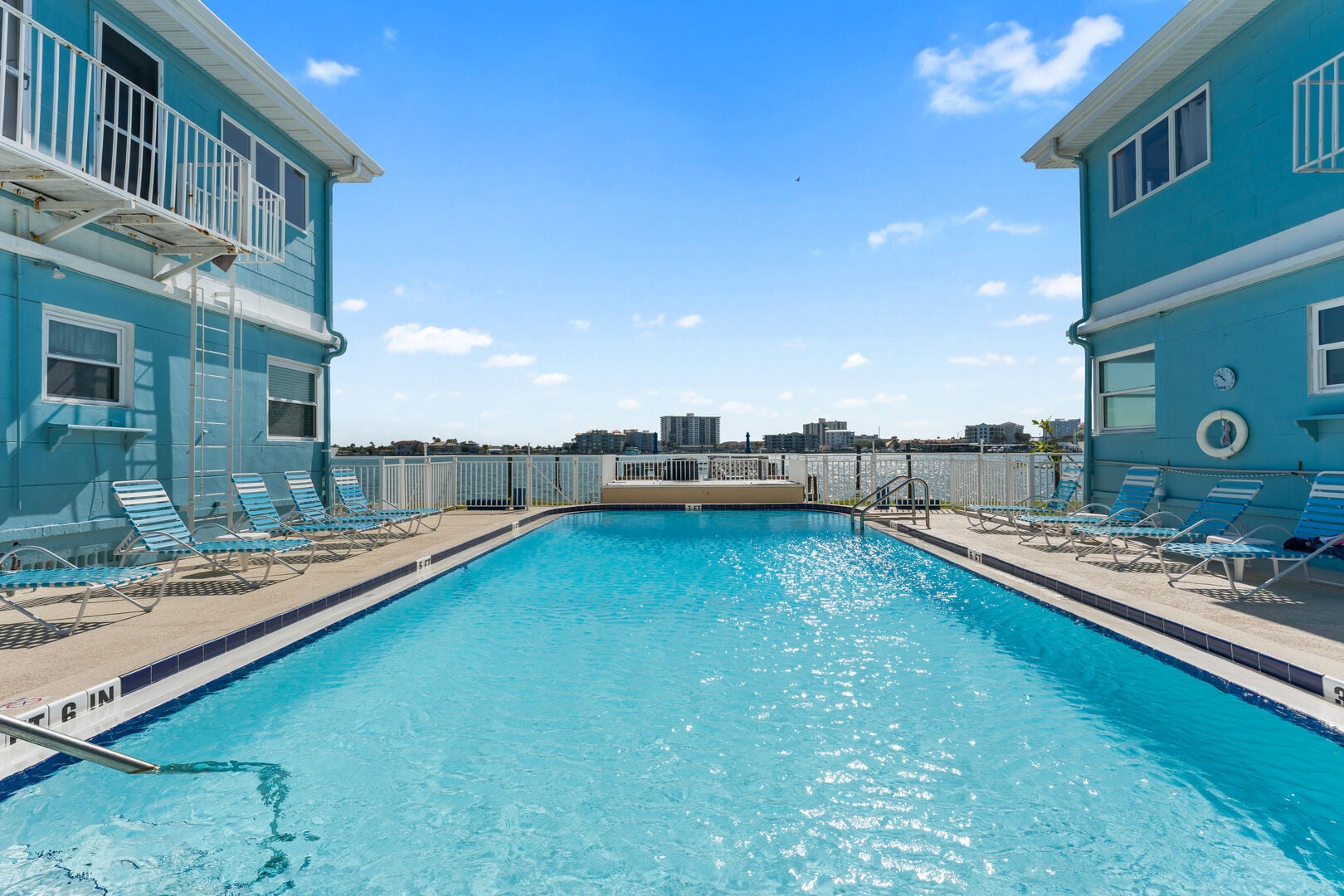 Tucked between the resort's low-rise buildings, the pool courtyard stays sheltered from the wind and open to the sky — a quiet alternative to the crowded hotel pools along Clearwater Beach.