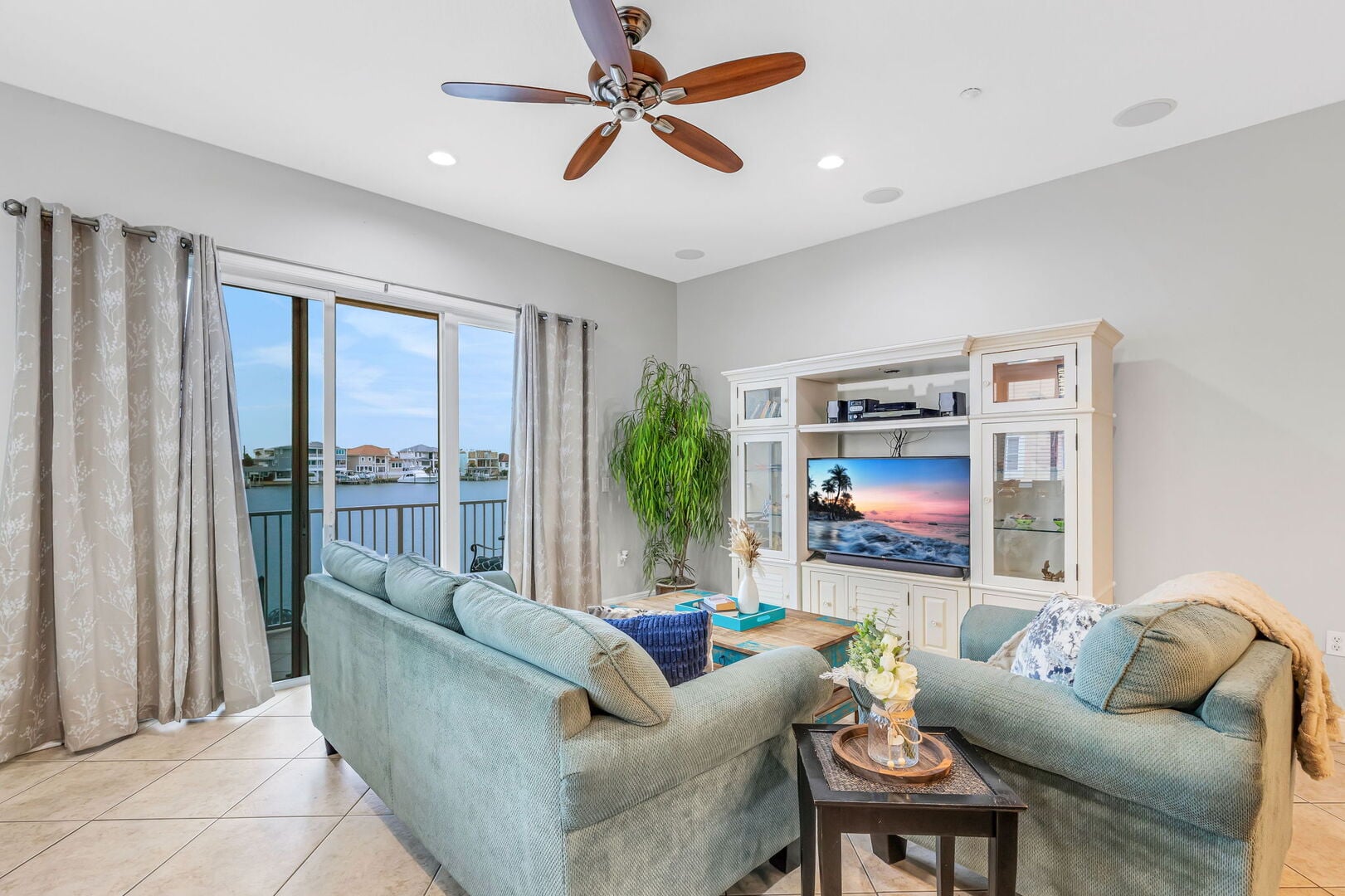 Boasting 2,400 sq. ft. of interior elegance and a spectacular private rooftop terrace, this end-unit offers panoramic views of the Intercoastal Waterway and frequent dolphin sightings.