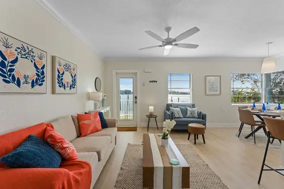 Vibrant coastal living room equipped with plenty of seating and a queen sized sofa sleeper