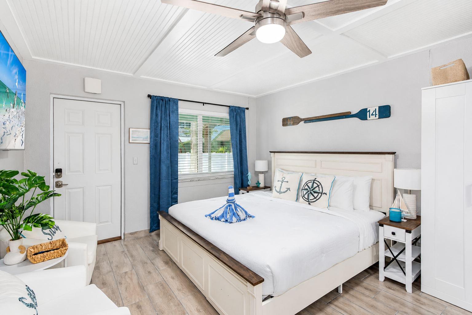 Sleeping Area: Features a plush King-sized bed shared with the main living space.