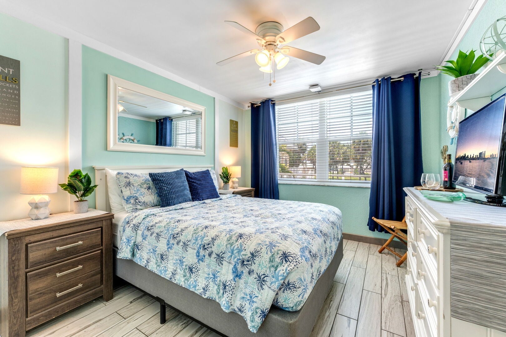 Bedroom: King-sized bed, ceiling fan, chair, and smart TV. Perfect for unwinding!