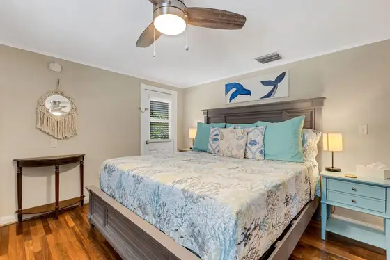 Comfortable bedroom with ample storage and calming beach-inspired décor
